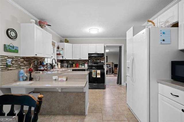 kitchen featuring black appliances, white cabinetry, kitchen peninsula, and ornamental molding