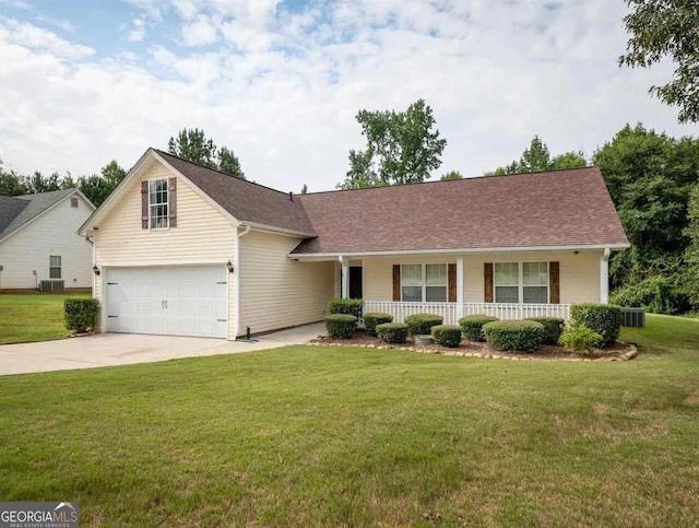 view of front facade featuring a garage, a front yard, and a porch