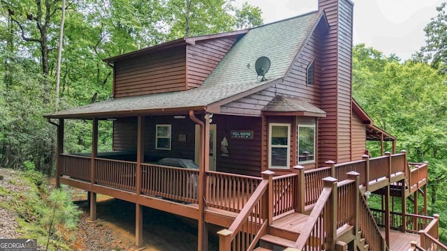 rear view of house with a deck