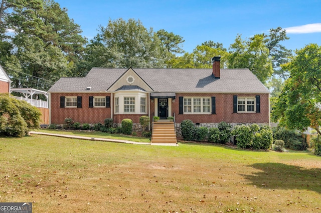 ranch-style home featuring a front lawn