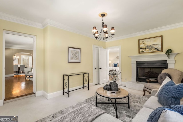 carpeted living room featuring a chandelier and ornamental molding