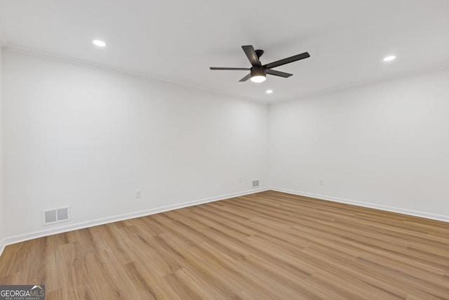 unfurnished room featuring light wood-type flooring and ceiling fan