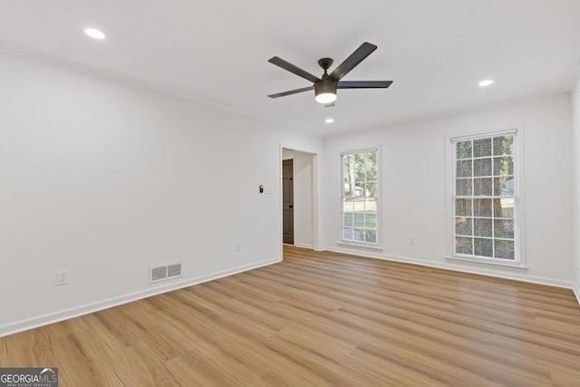 spare room with ceiling fan, light hardwood / wood-style flooring, and crown molding