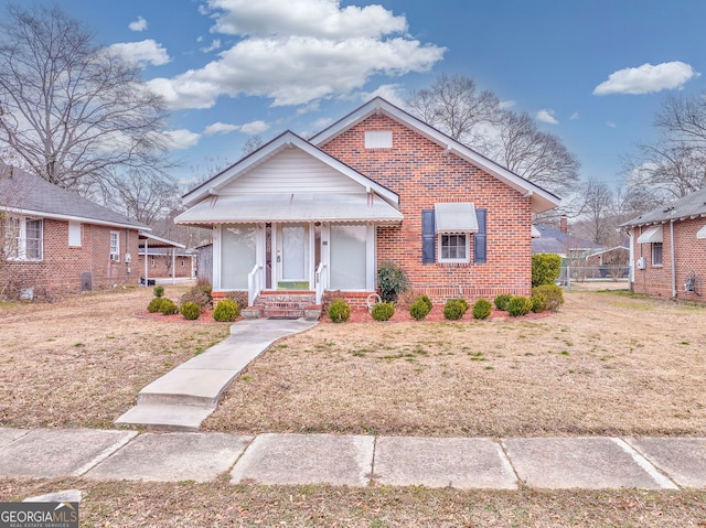 bungalow-style house with a front yard