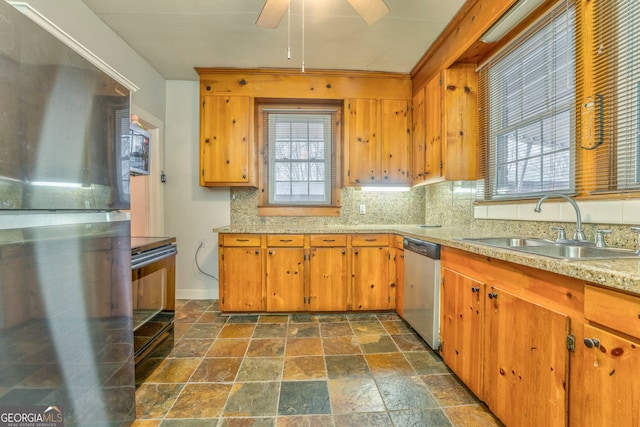 kitchen featuring sink, stainless steel appliances, ceiling fan, and tasteful backsplash