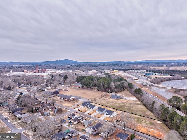 birds eye view of property featuring a mountain view