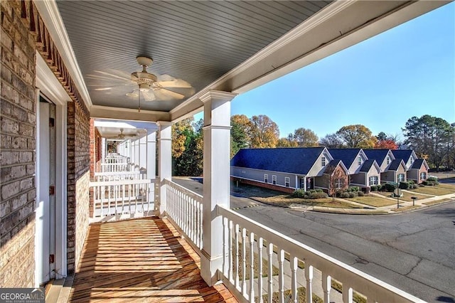 balcony featuring covered porch and ceiling fan