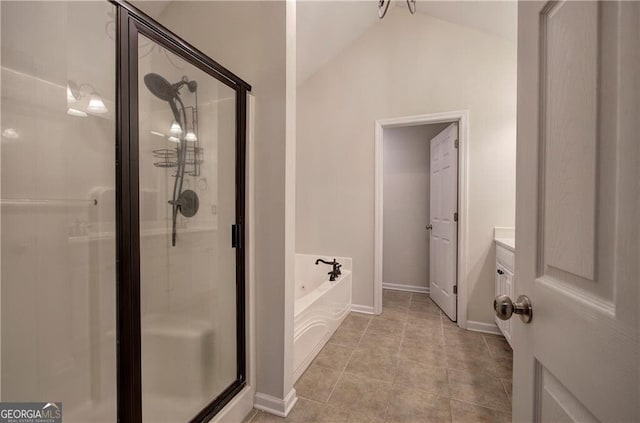 bathroom featuring lofted ceiling, vanity, tile patterned floors, and separate shower and tub