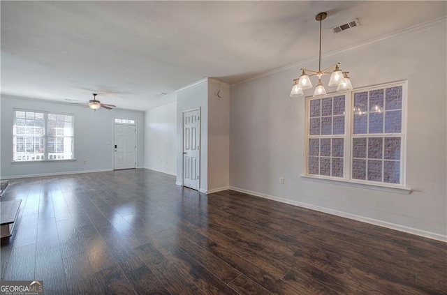 empty room featuring crown molding, dark hardwood / wood-style floors, and ceiling fan