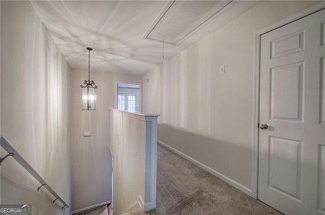 hallway with carpet floors