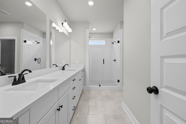 bathroom featuring an enclosed shower and vanity