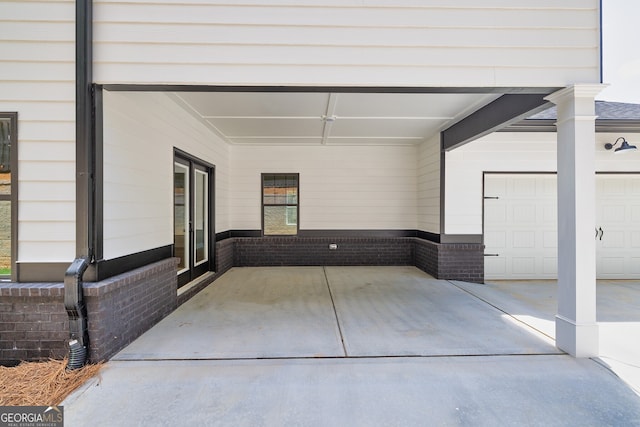 view of patio / terrace with a garage