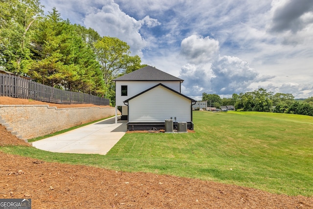 view of property exterior featuring a yard and a patio area