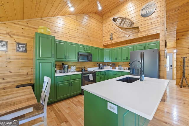 kitchen with green cabinetry, wooden ceiling, a kitchen island with sink, and stainless steel appliances