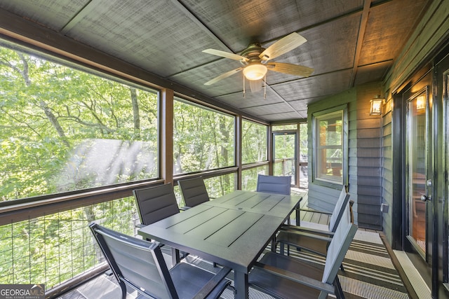 sunroom with ceiling fan and a healthy amount of sunlight