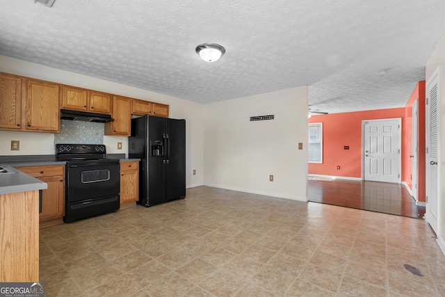 kitchen featuring black appliances, a textured ceiling, and ceiling fan