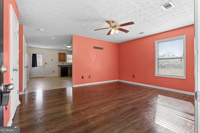 unfurnished living room featuring ceiling fan and dark hardwood / wood-style floors