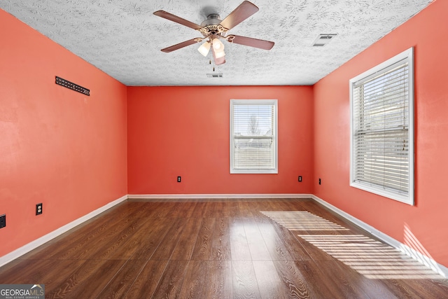 unfurnished room with hardwood / wood-style flooring, a textured ceiling, and ceiling fan