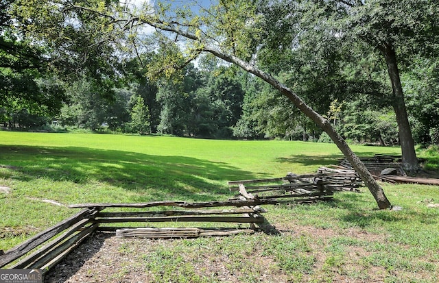 view of property's community with a yard