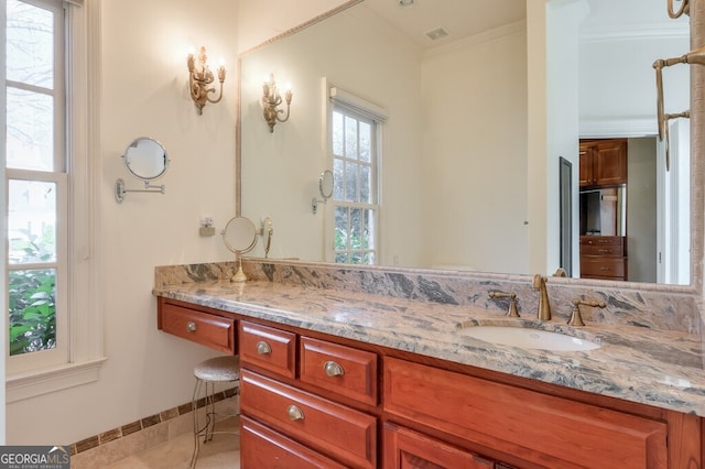 bathroom featuring tile patterned floors, vanity, and ornamental molding