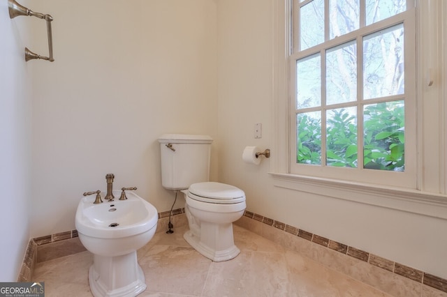 bathroom featuring a bidet and toilet