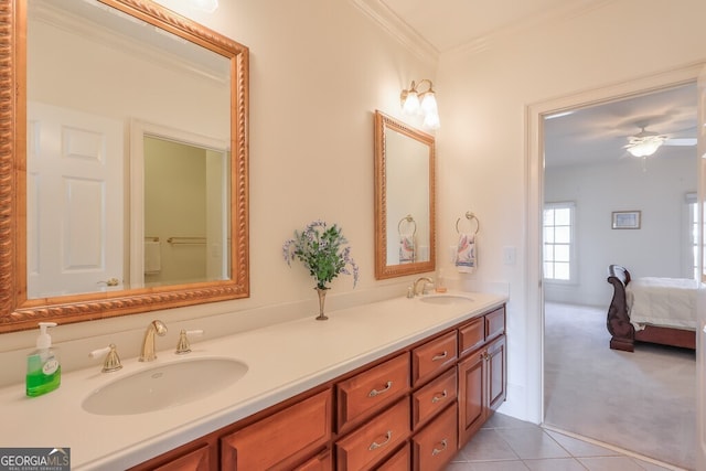 bathroom featuring tile patterned floors, ceiling fan, ornamental molding, and vanity