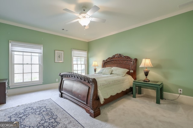 bedroom featuring ceiling fan, light carpet, and ornamental molding