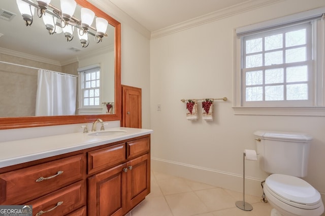 bathroom with toilet, vanity, tile patterned floors, and ornamental molding