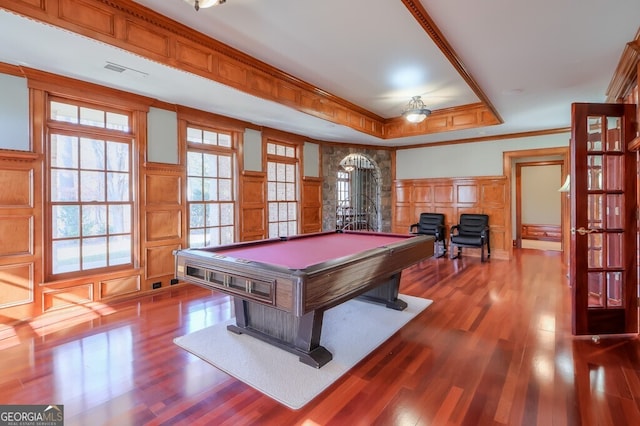 recreation room featuring billiards, a tray ceiling, crown molding, and a healthy amount of sunlight