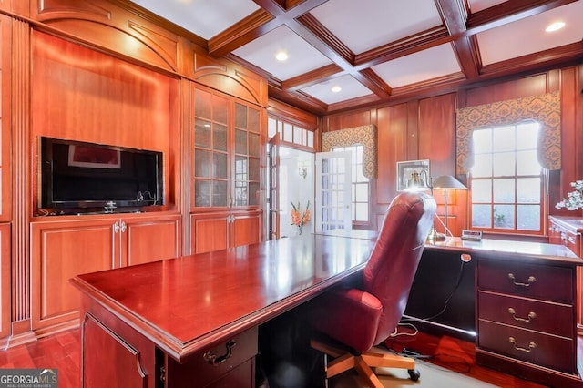 office with coffered ceiling, wooden walls, beamed ceiling, and ornamental molding