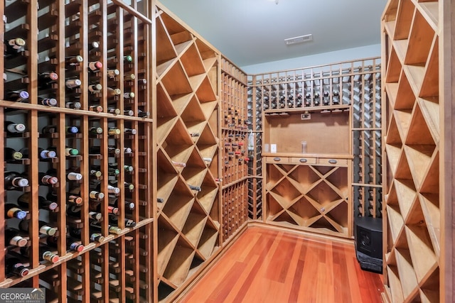 wine cellar featuring hardwood / wood-style floors