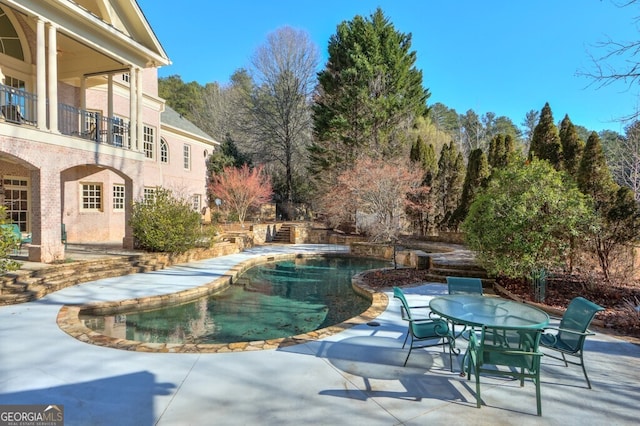 view of pool with a patio