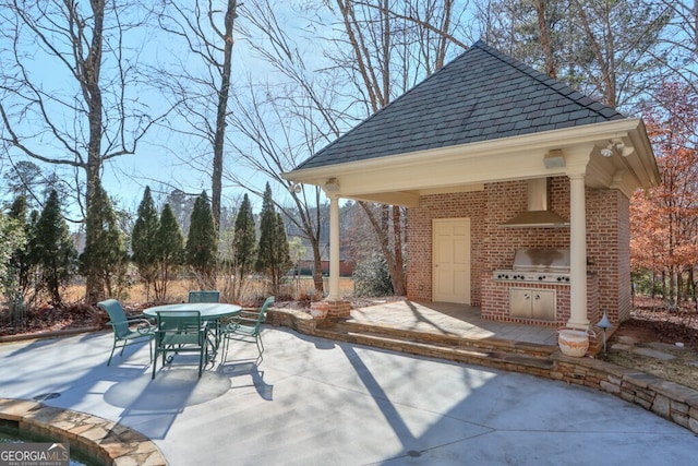 view of patio with an outdoor kitchen, a gazebo, and a grill