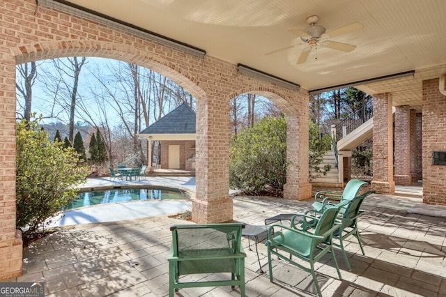 view of patio featuring ceiling fan