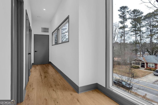 hallway with light wood-type flooring