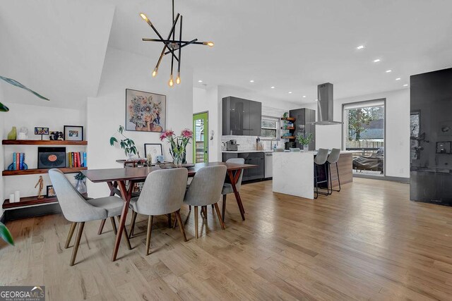 dining area featuring a chandelier and light wood-type flooring