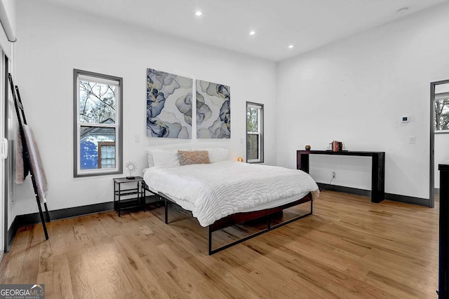 bedroom with light wood-type flooring