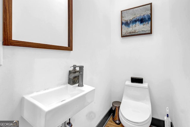 bathroom with sink and toilet