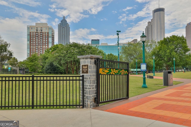 view of property's community with a lawn