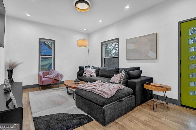 living room with light hardwood / wood-style flooring