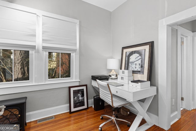 home office featuring hardwood / wood-style flooring