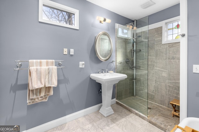 bathroom featuring tiled shower