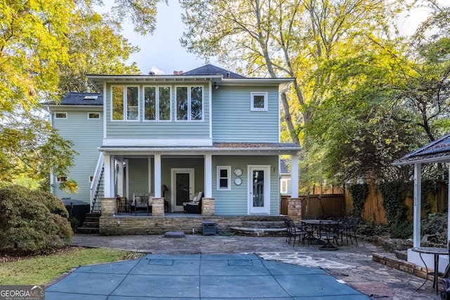 back of property with a patio area