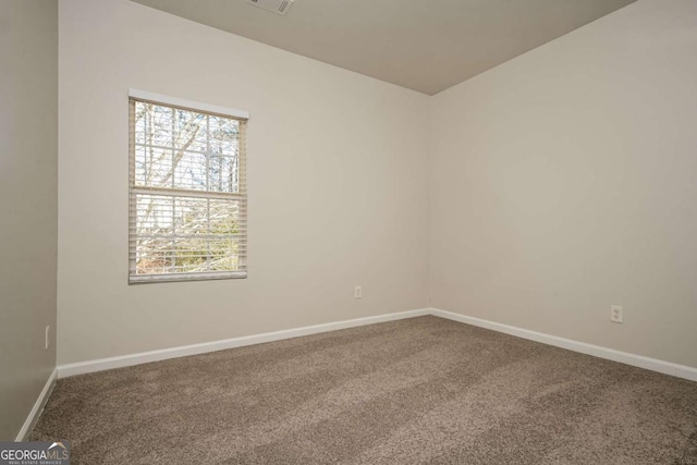 spare room featuring carpet floors