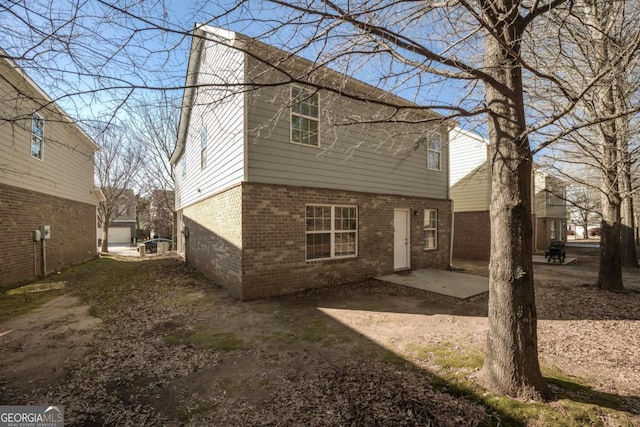 rear view of property featuring a patio area