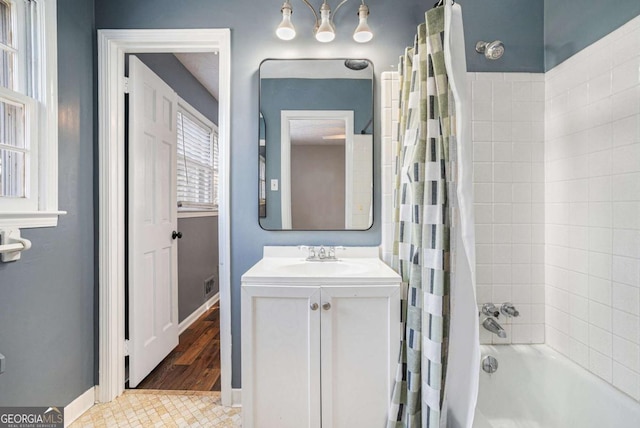 bathroom with vanity and shower / tub combo