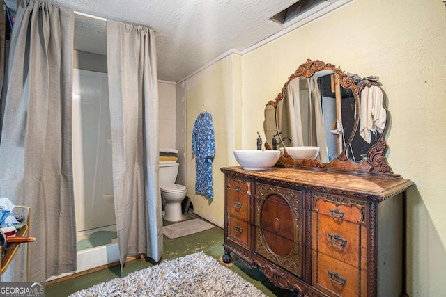 full bathroom featuring toilet, concrete flooring, a textured ceiling, shower / bath combo, and vanity