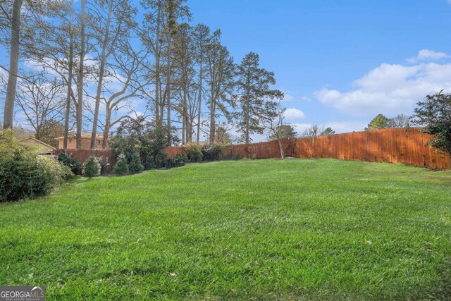 back of house with a patio, central AC unit, and a lawn