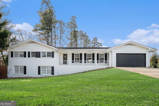 view of front facade with a garage and a front lawn