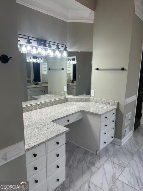 bathroom featuring vanity and crown molding